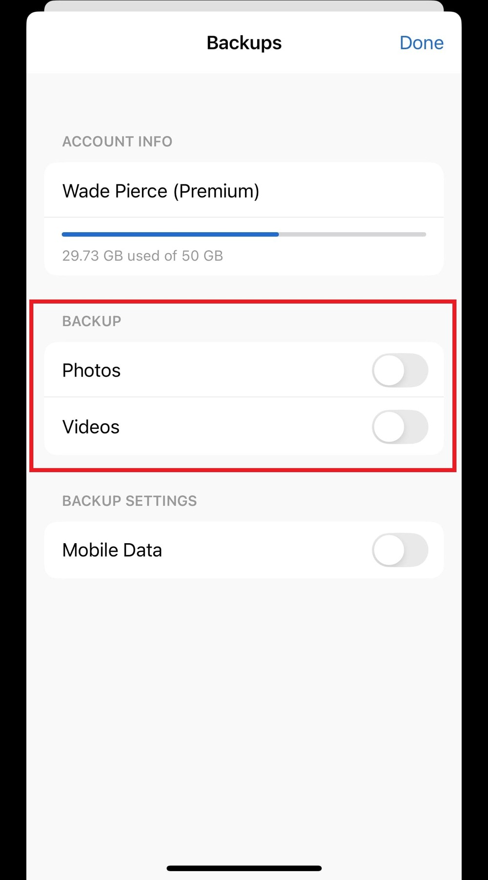 MobiDrive for iOS "Backups" settings screen showcasing account info for Wade Pierce, with toggles to back up "Photos" and "Videos," and an option to use "Mobile Data" for backups.